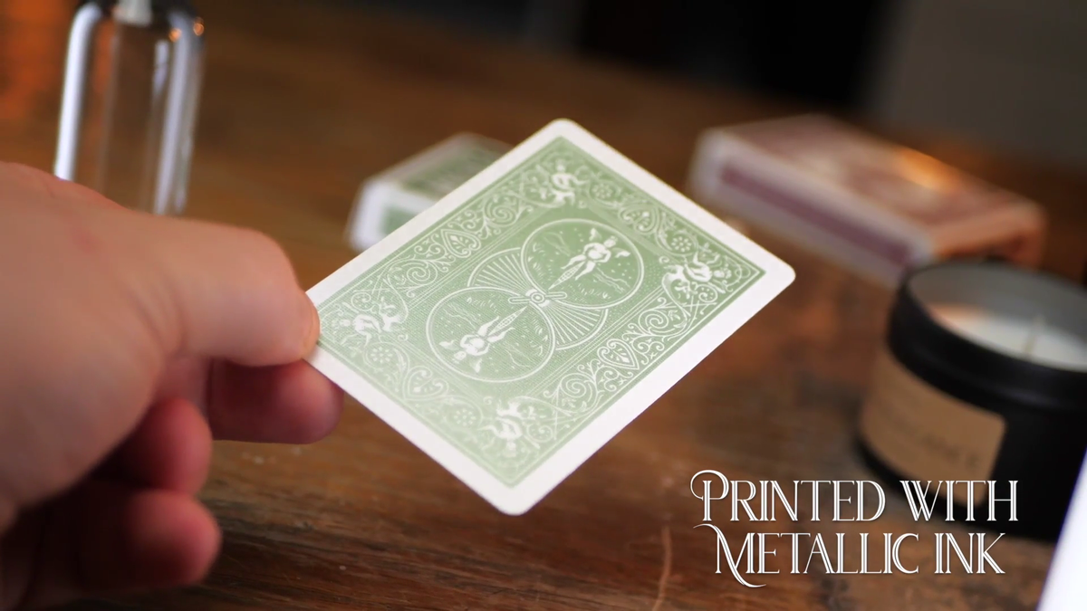 Bicycle Metallic Emerald card held at an angle to show reflective green metallic ink