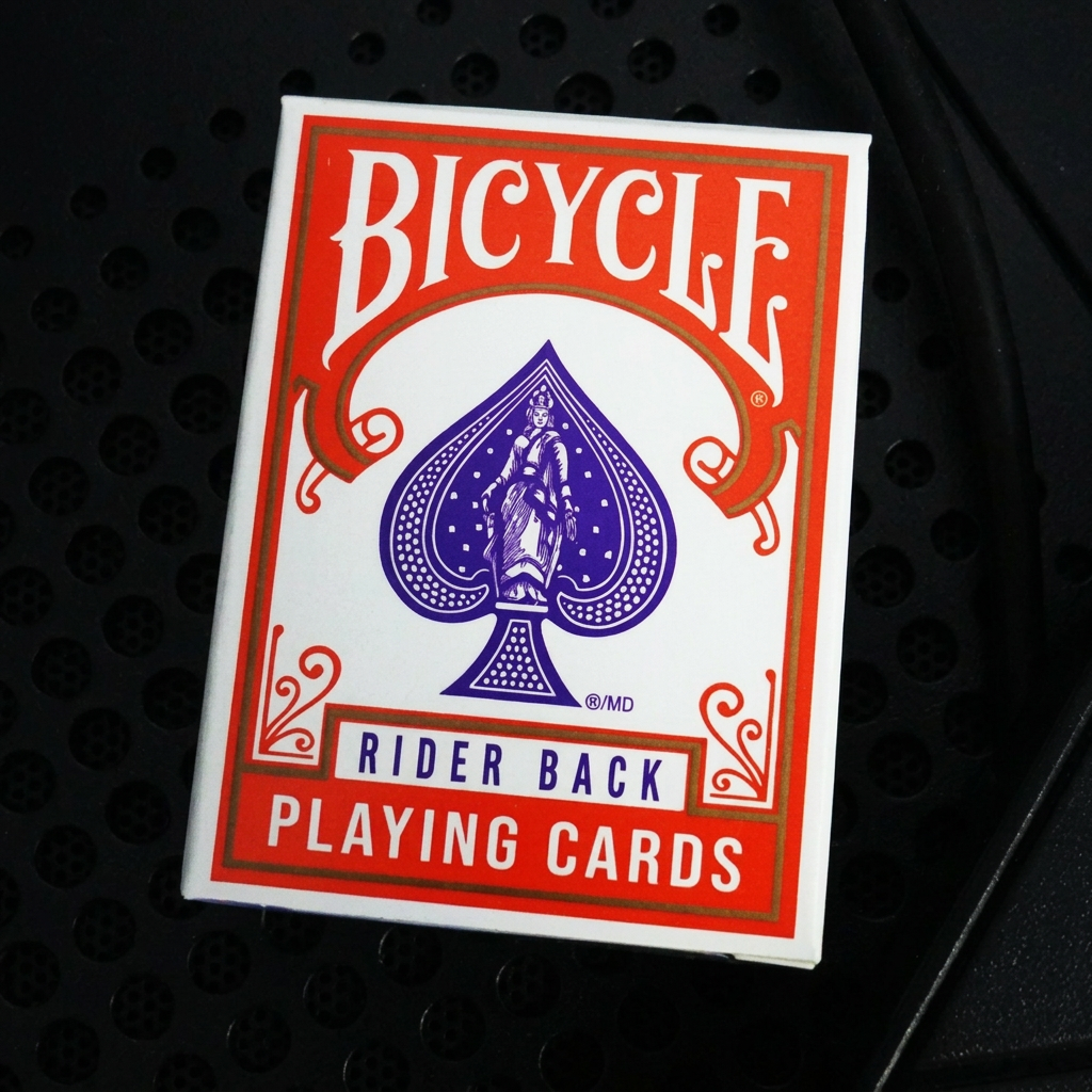 Front of Bicycle Mini Orange Rider Back Playing Cards tuck box with Bicycle branding and miniature design