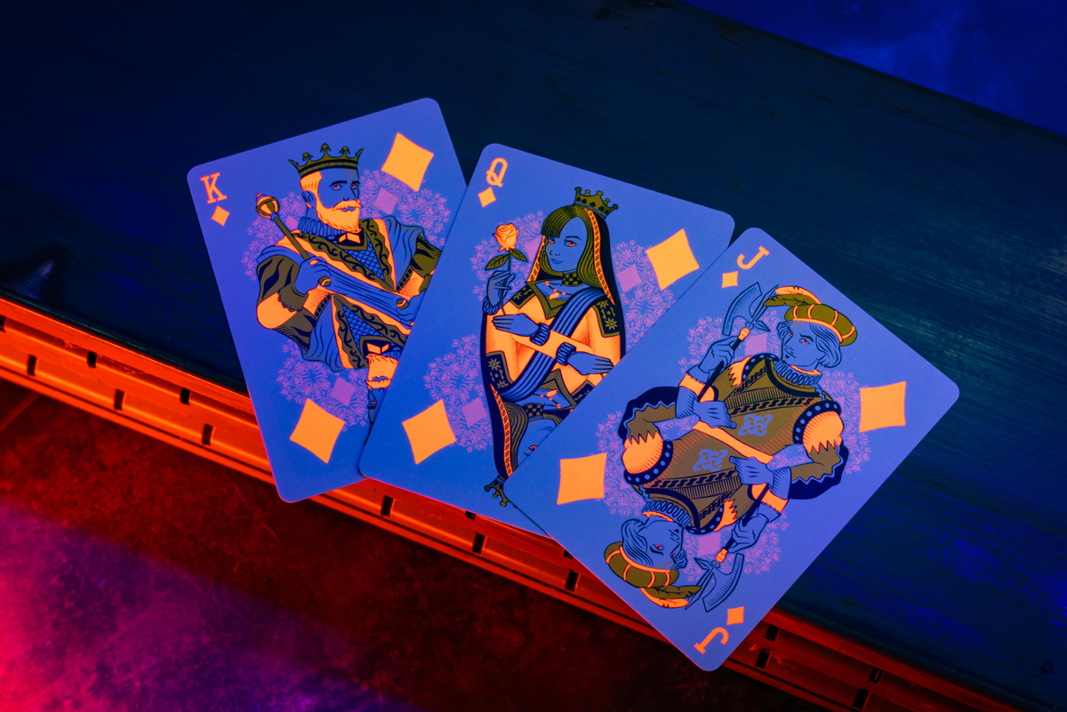 Bicycle Neon Solar-Orange custom diamond court cards under UV blacklight