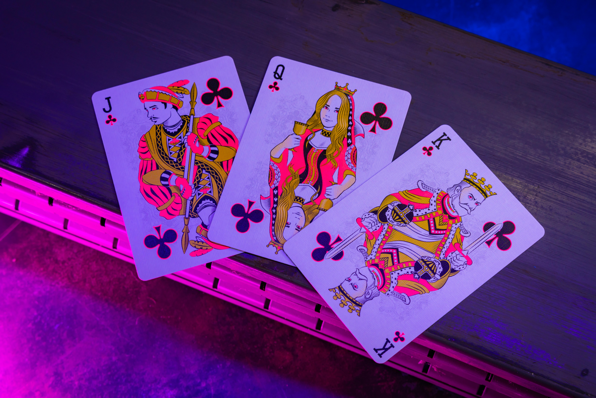 Bicycle Neon Star-Fire Pink custom club court cards under UV blacklight