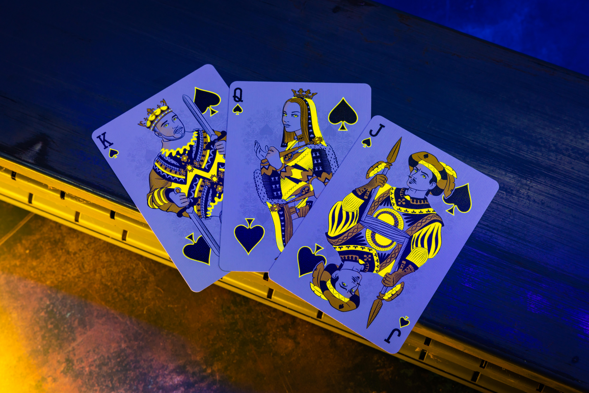 Bicycle Neon Yellow-Starburst custom spade court cards under UV blacklight