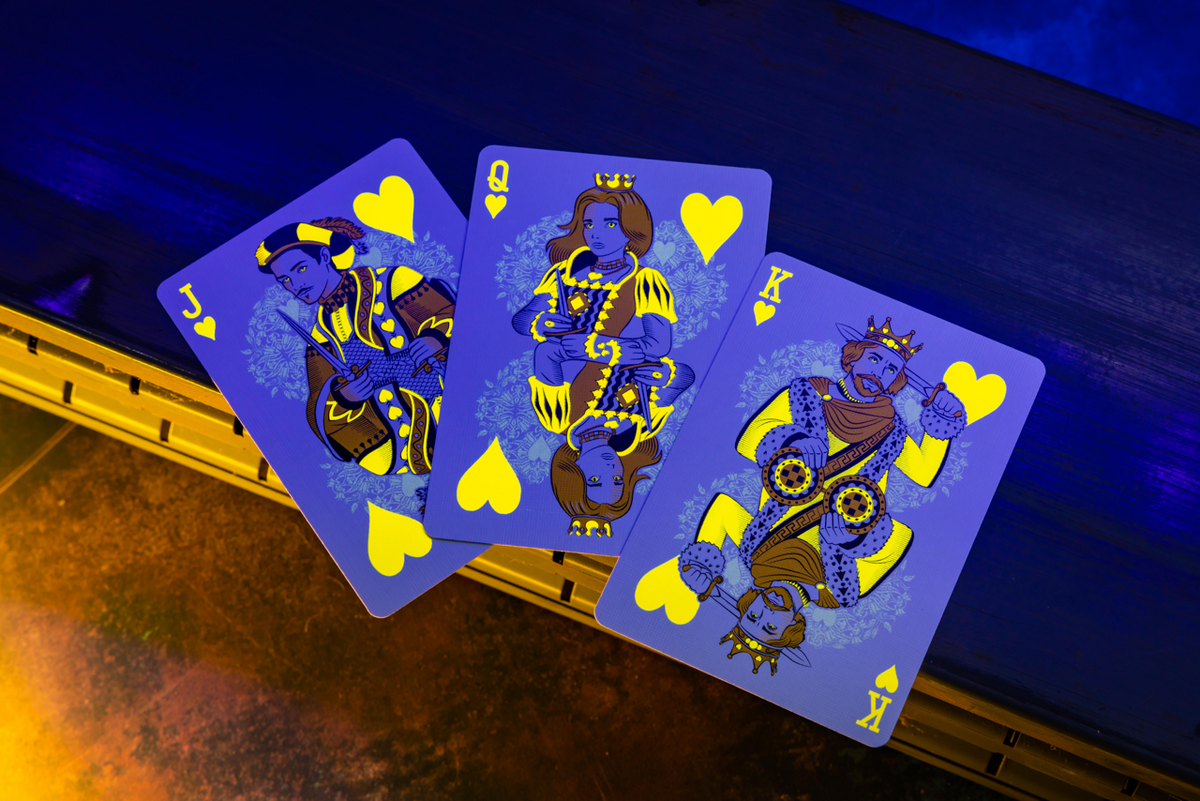 Bicycle Neon Yellow-Starburst custom heart court cards under UV blacklight