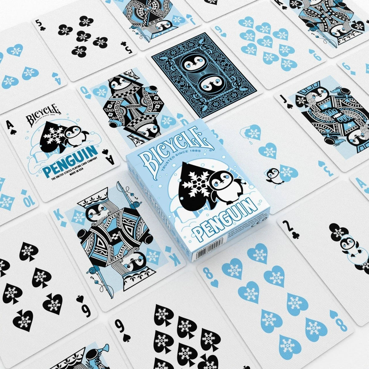 Bicycle Penguin tuck box surrounded by penguin court cards, a custom Ace of Spades, snowflake number cards, and a card back
