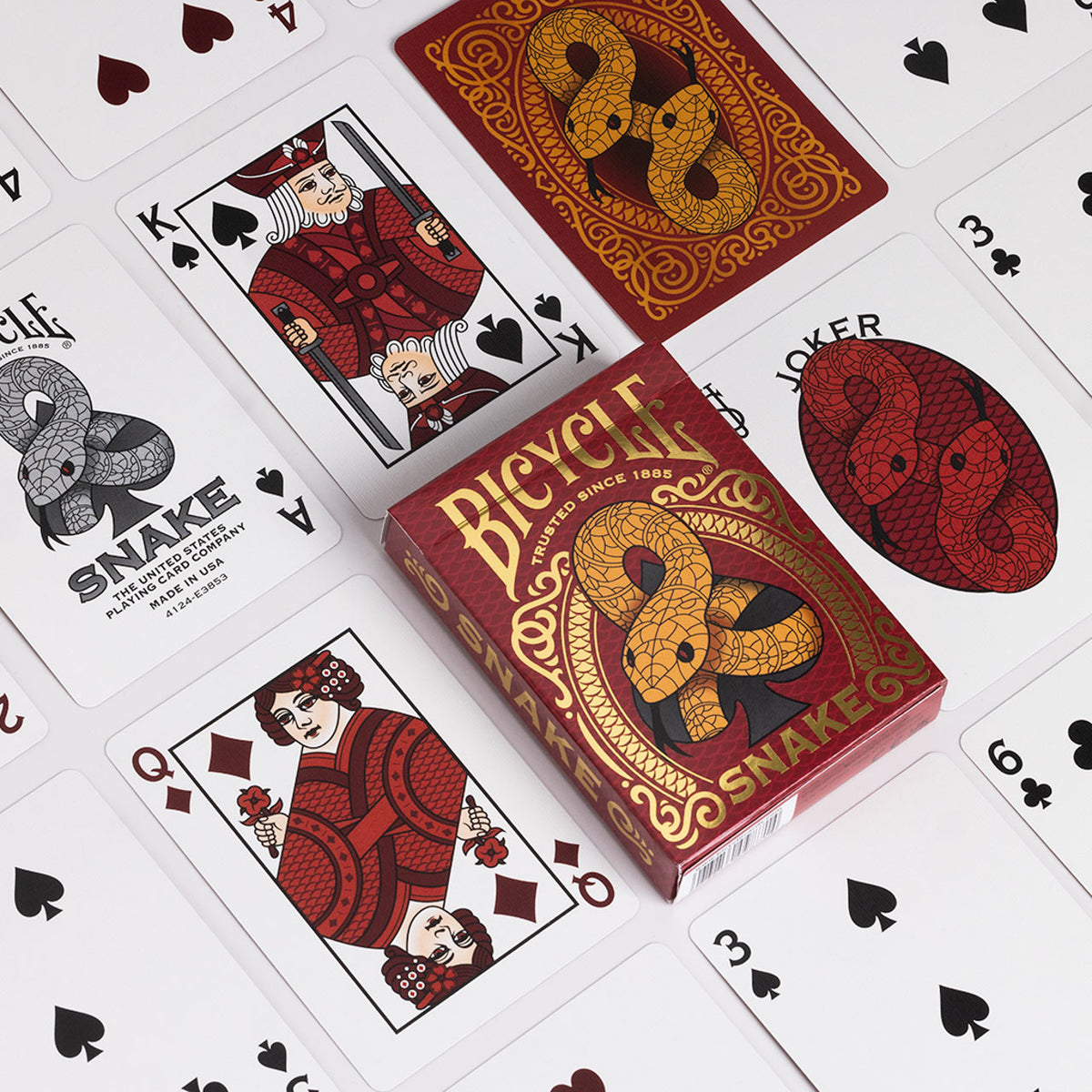 Bicycle Snake tuck box among kimono-inspired courts, the serpent Ace of Spades, a red snake Joker, number cards, and a card back.