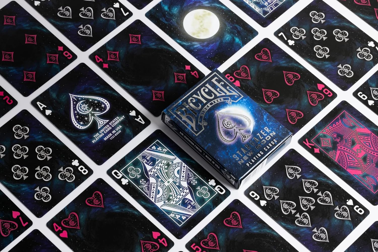 Bicycle Stargazer New Moon Playing Cards with silver-foil tuck, black cosmic faces, and custom white and magenta suits