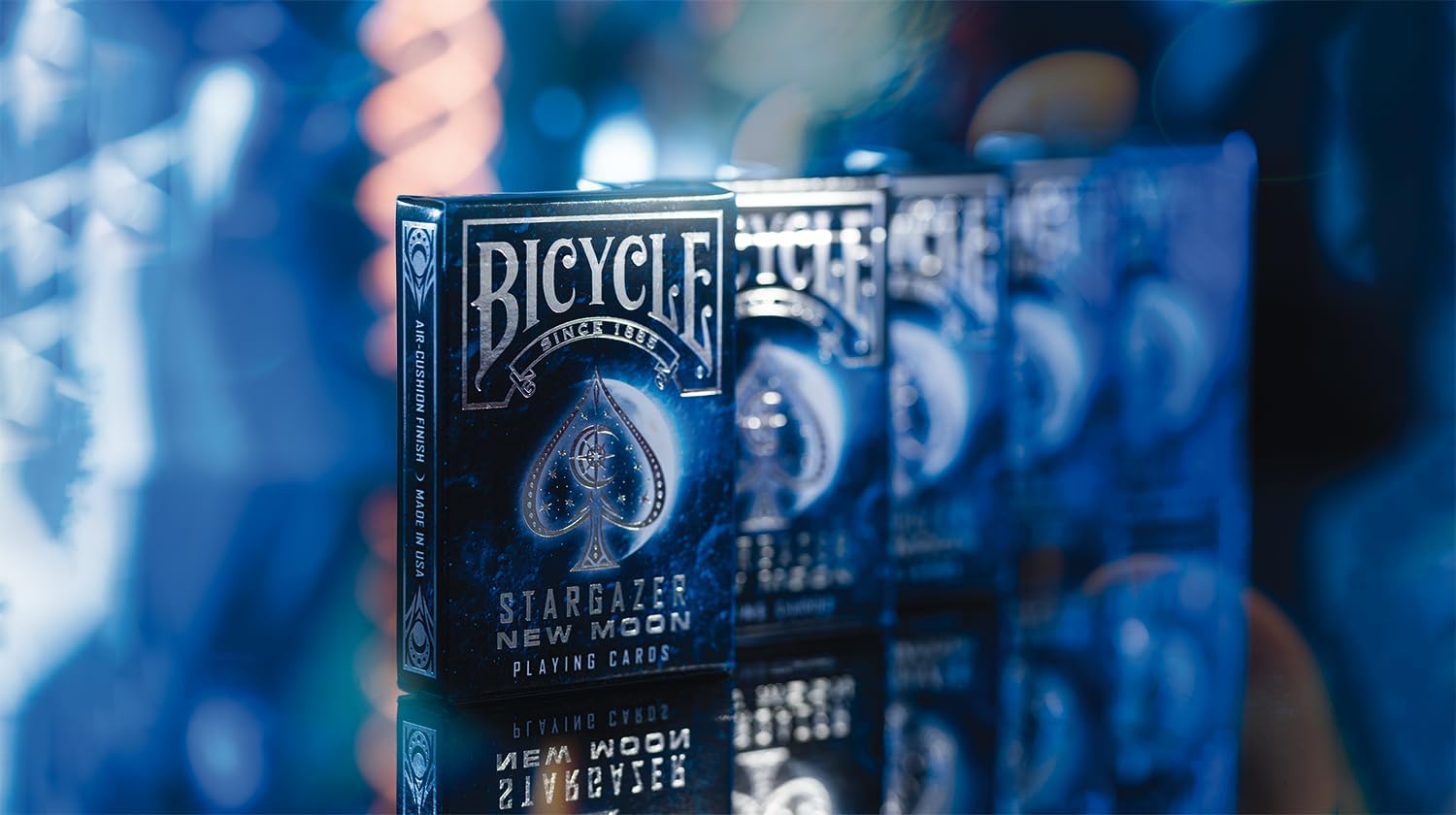 Bicycle Stargazer New Moon silver-foil tuck box displayed with additional cosmic decks in the background