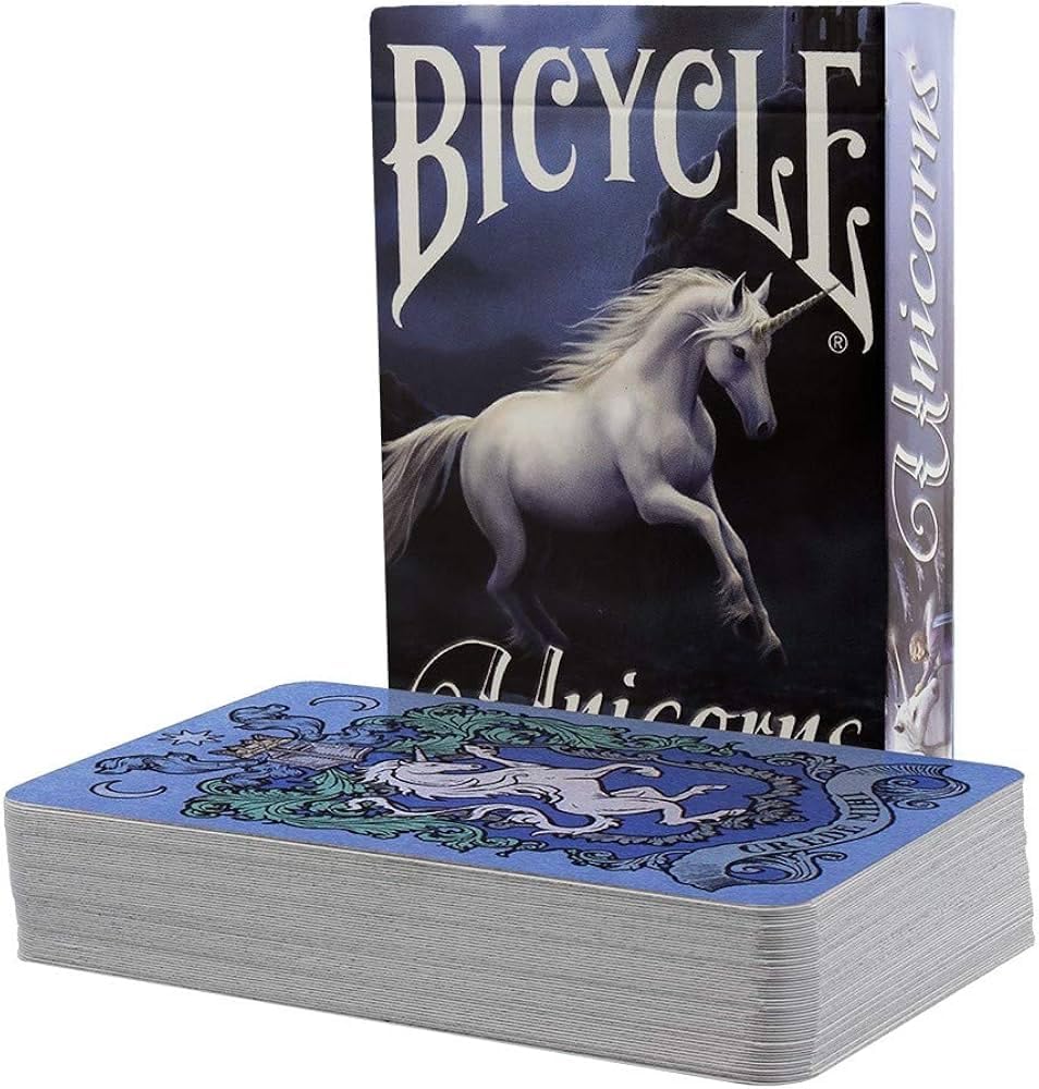 Bicycle Unicorns deck showing blue heraldic unicorn card back beside illustrated Bicycle tuck box