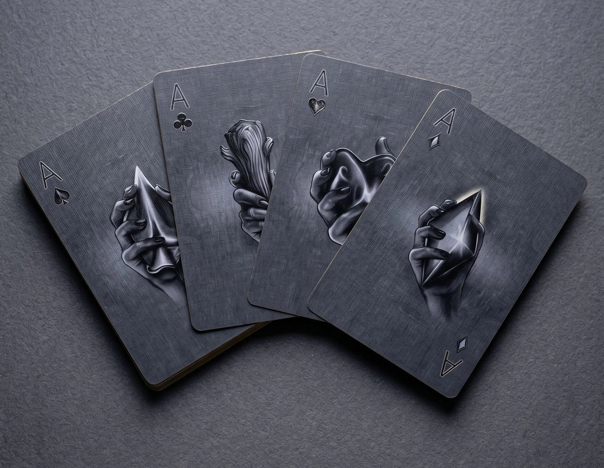 All four Classic Monsters Playing Cards Aces featuring illustrated hands holding sculpted spade, club, heart, and diamond symbols