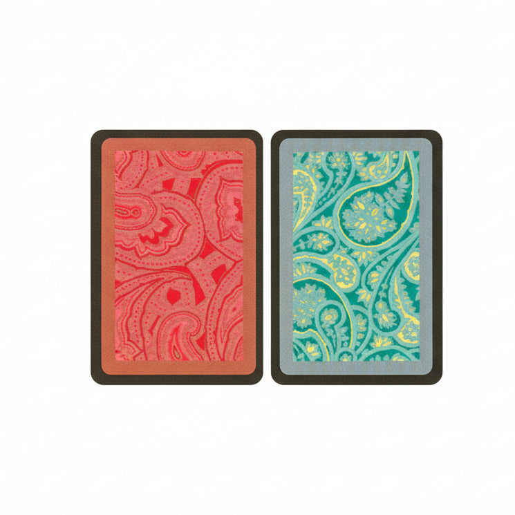 Two Congress playing card decks with red and green paisley patterns on a black border.