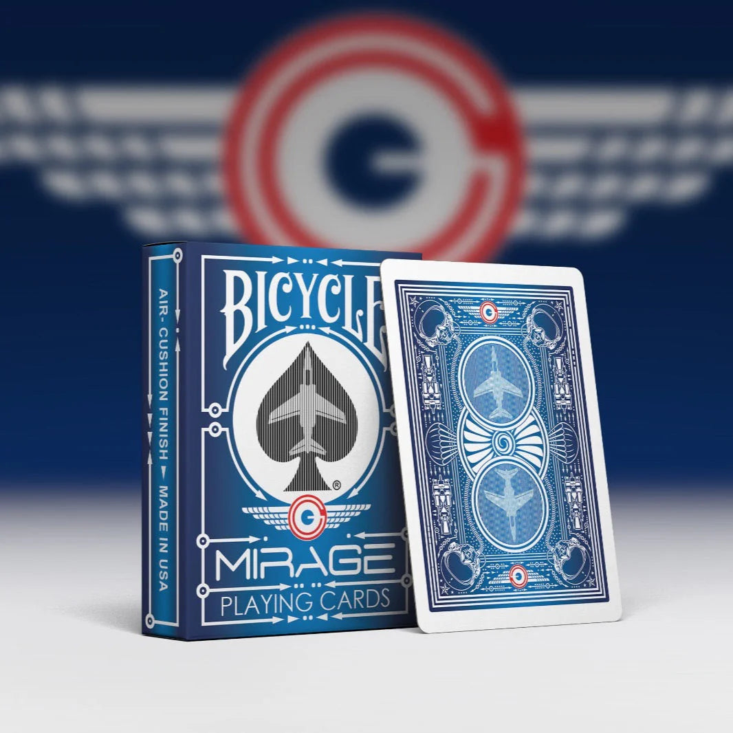 Bicycle Mirage playing cards with a blue and white design on a blurred background
