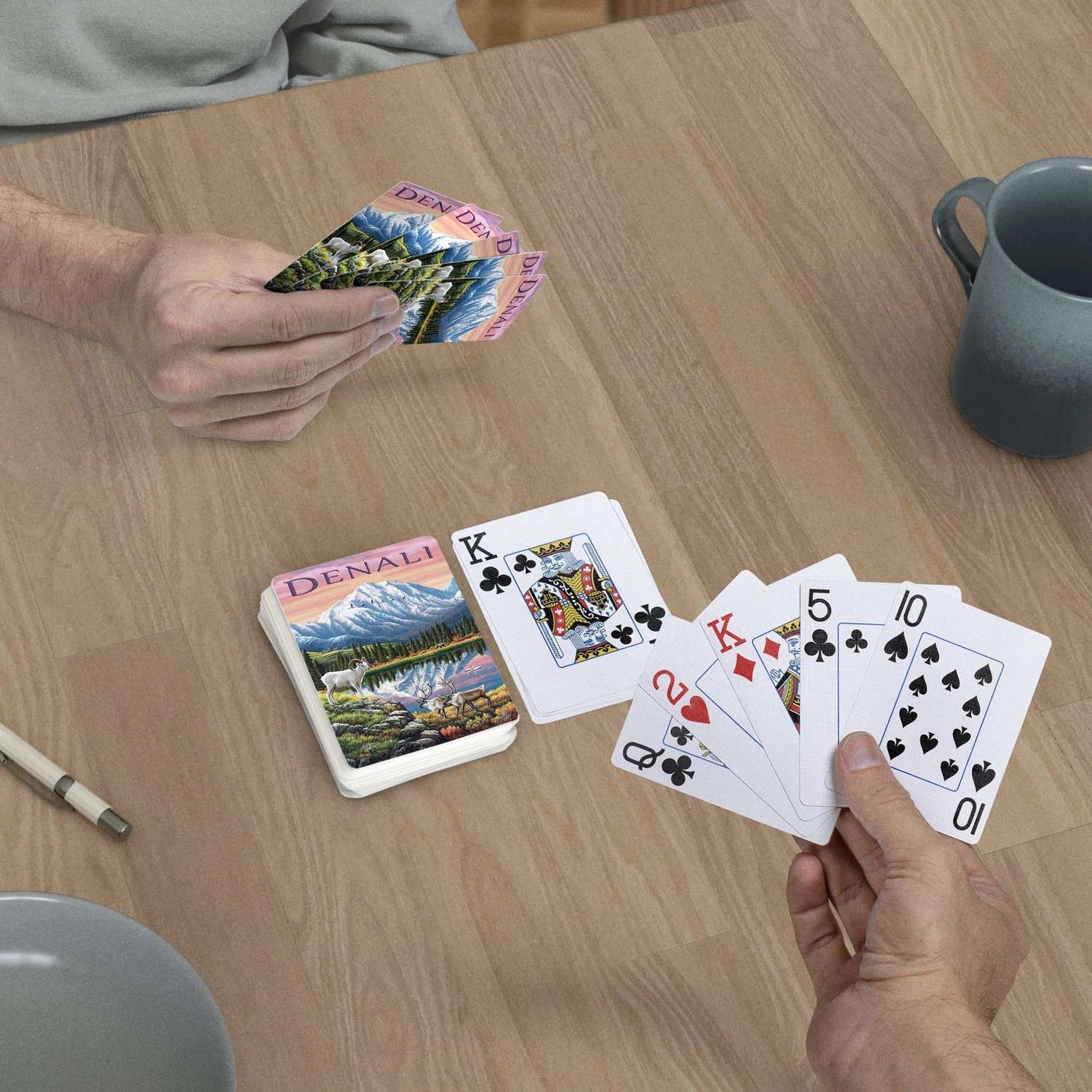 Denali jumbo-index playing cards in use at a table with Alaska mountain and wildlife card backs