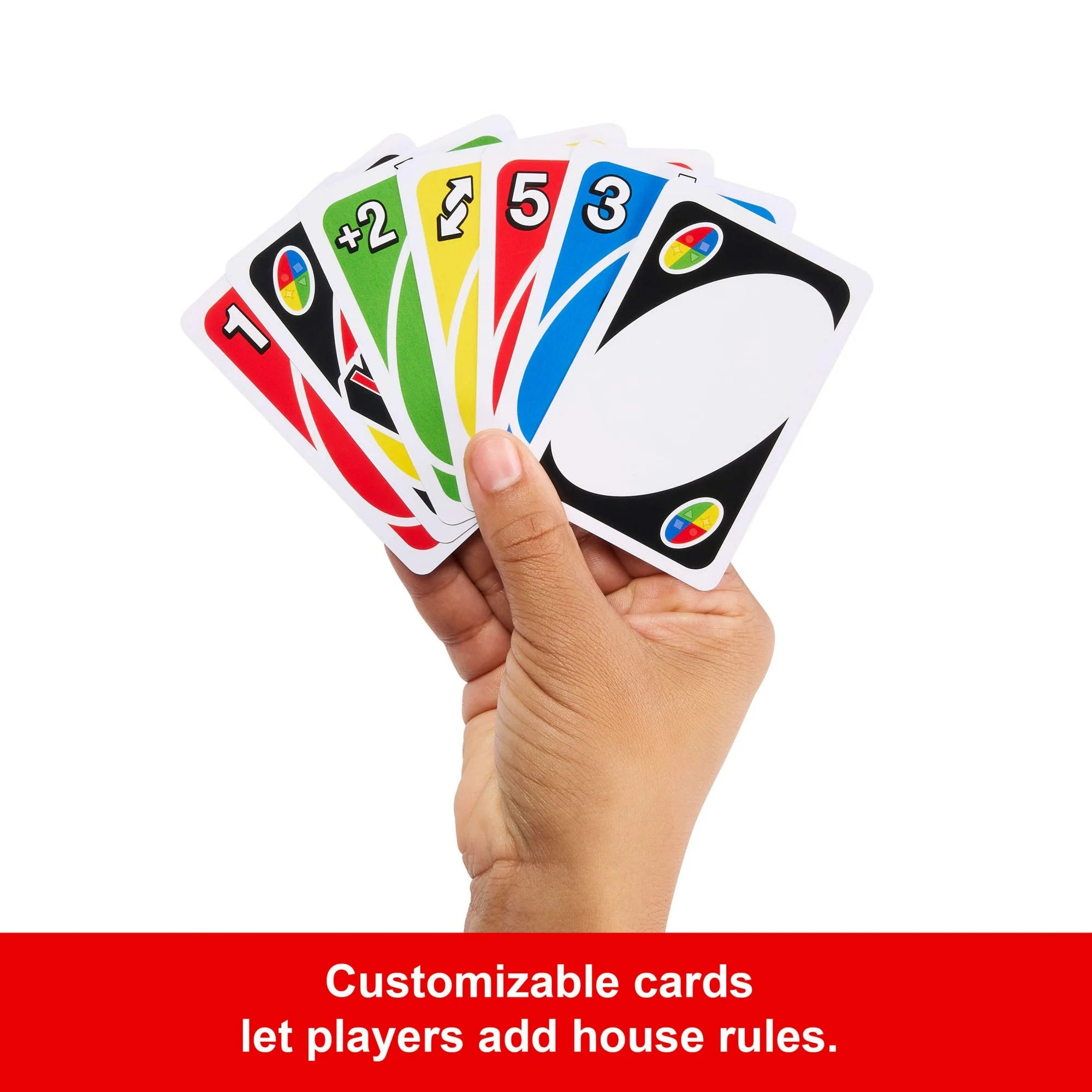 Hand holding UNO game cards with various symbols on a white background