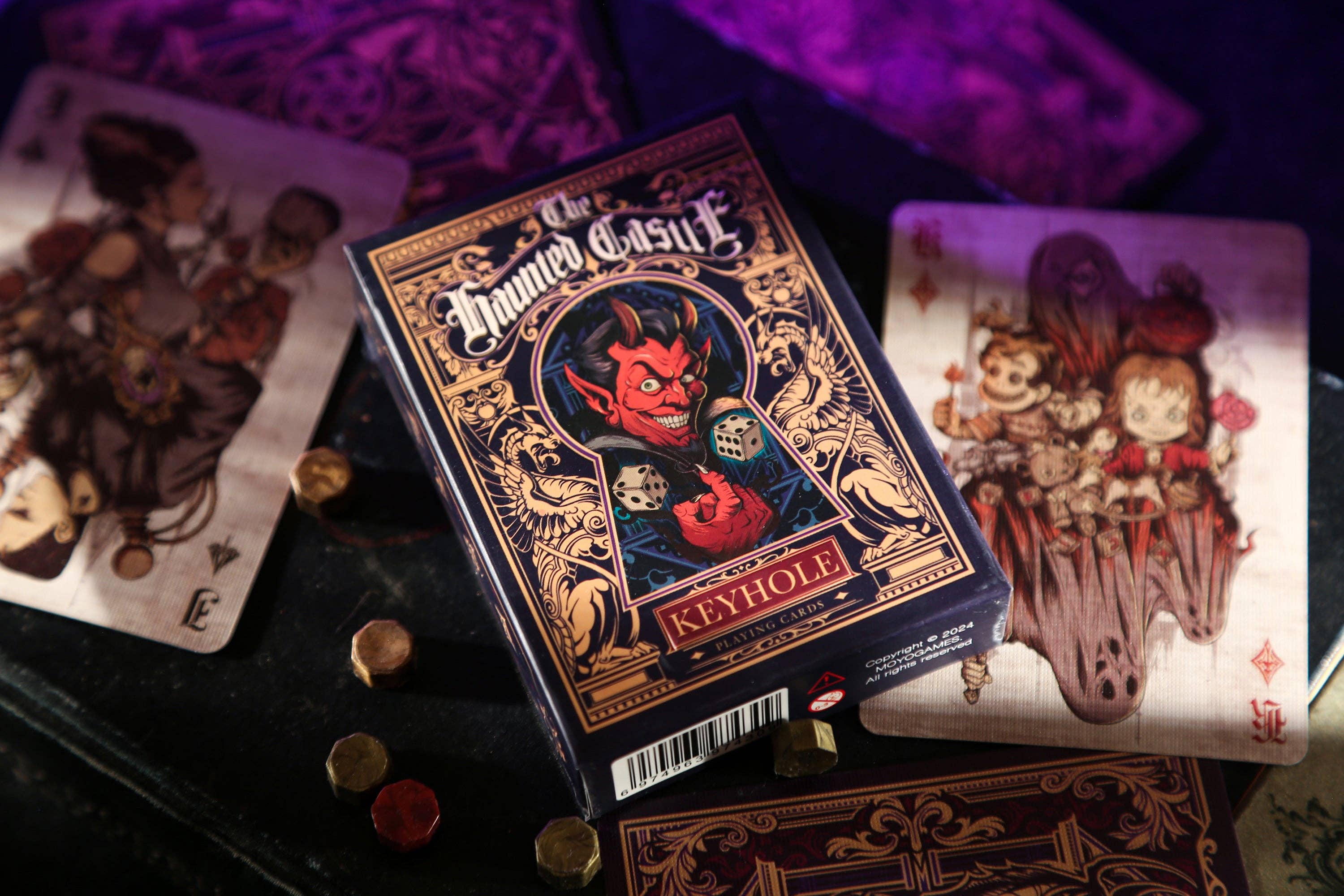 Playing cards with a devilish design on a dark surface