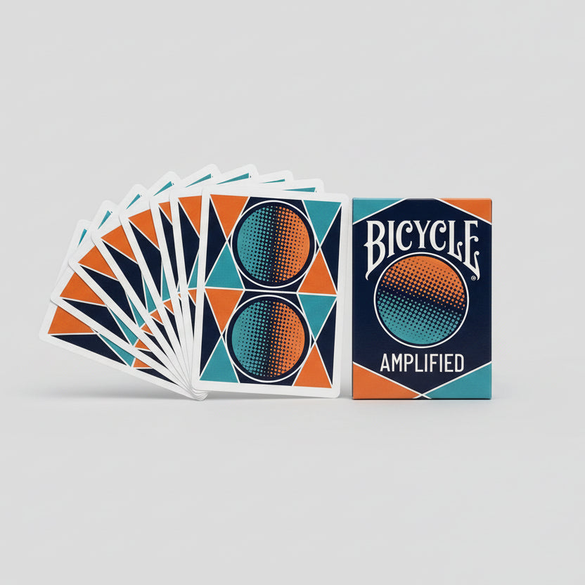 Bicycle Amplified playing cards on a brown surface