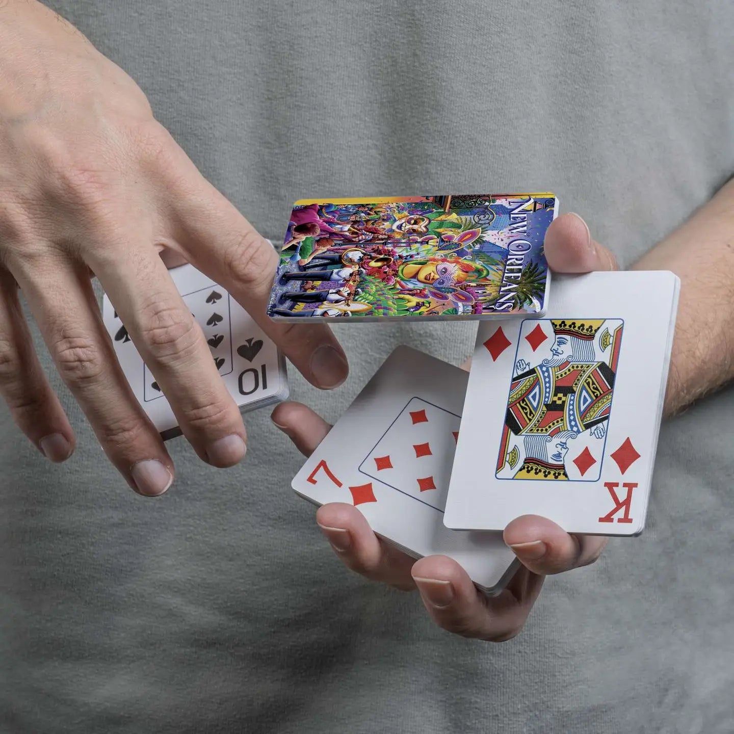 New Orleans Mardi Gras scenic playing cards displayed in a cascading spring
