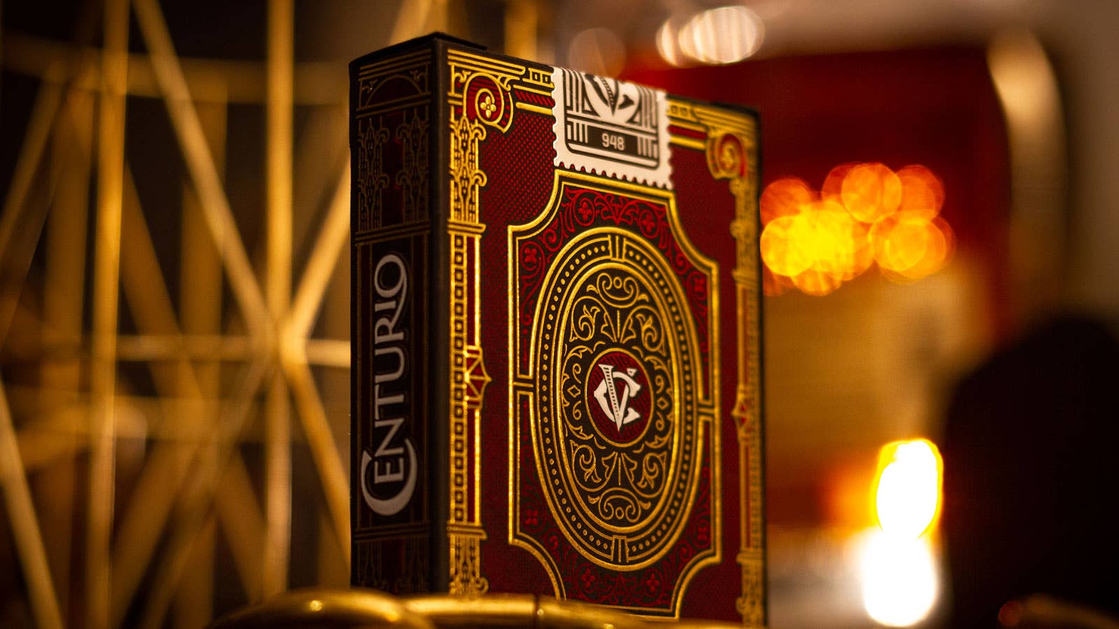 Centurio playing card box with a warm, blurred background