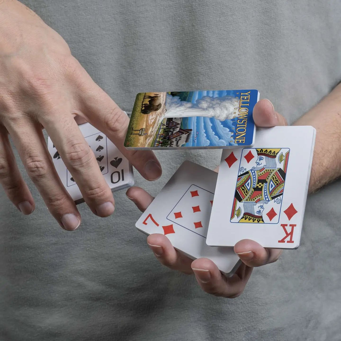 Yellowstone National Park playing cards displayed in a cascading spring