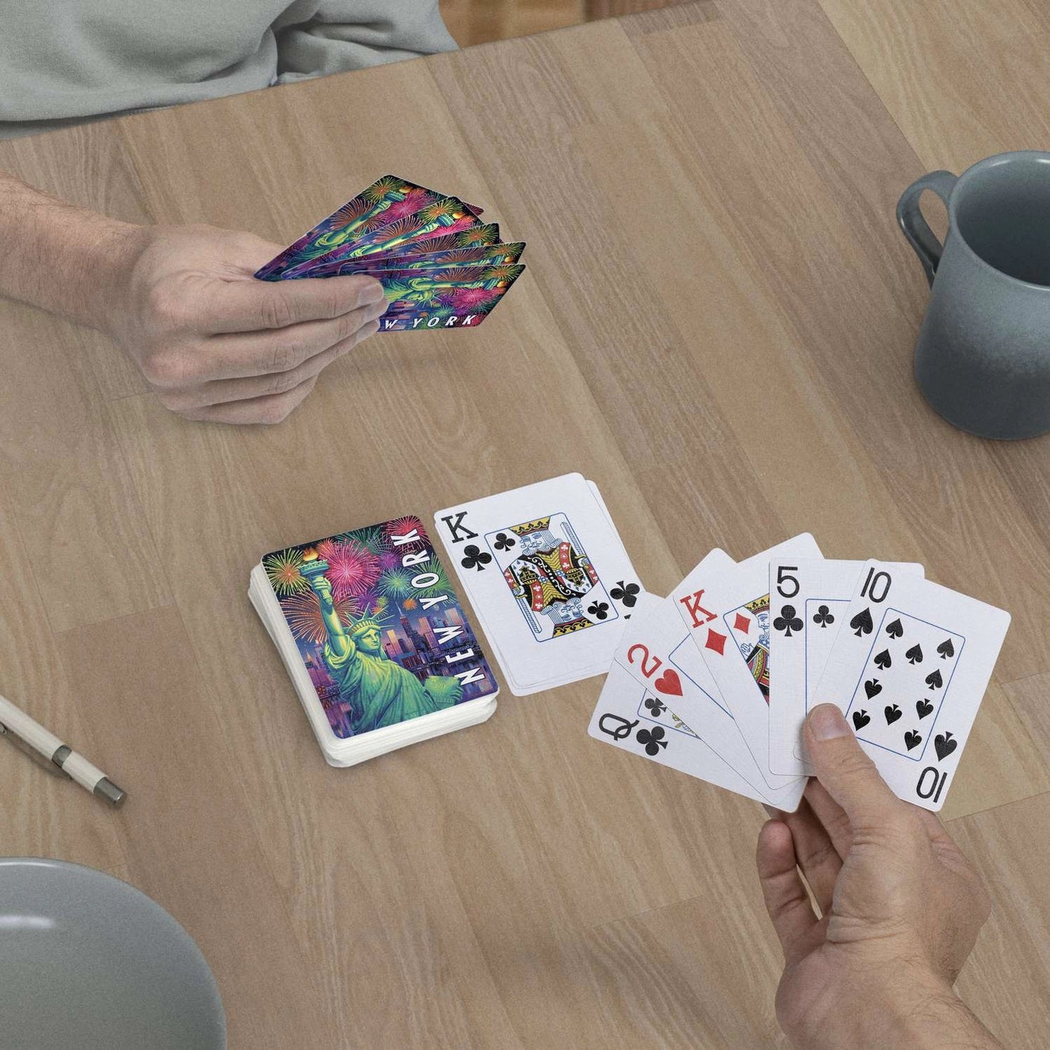 New York Lady Liberty jumbo-index playing cards in use at a table with Statue of Liberty card backs