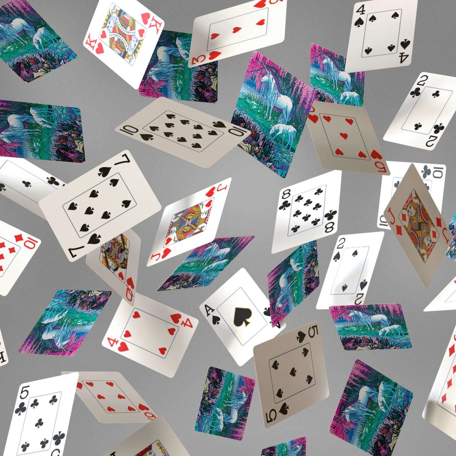 Finding Unicorns playing cards showing jumbo-index faces and colorful unicorn fantasy card backs