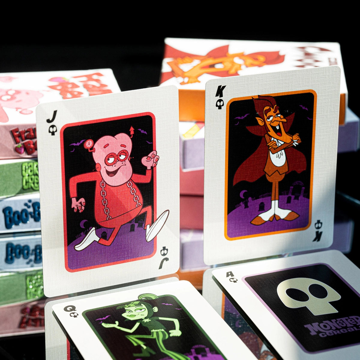 Monster Cereals court cards featuring Franken Berry, Count Chocula, and Carmella Creeper beside the skull Ace.