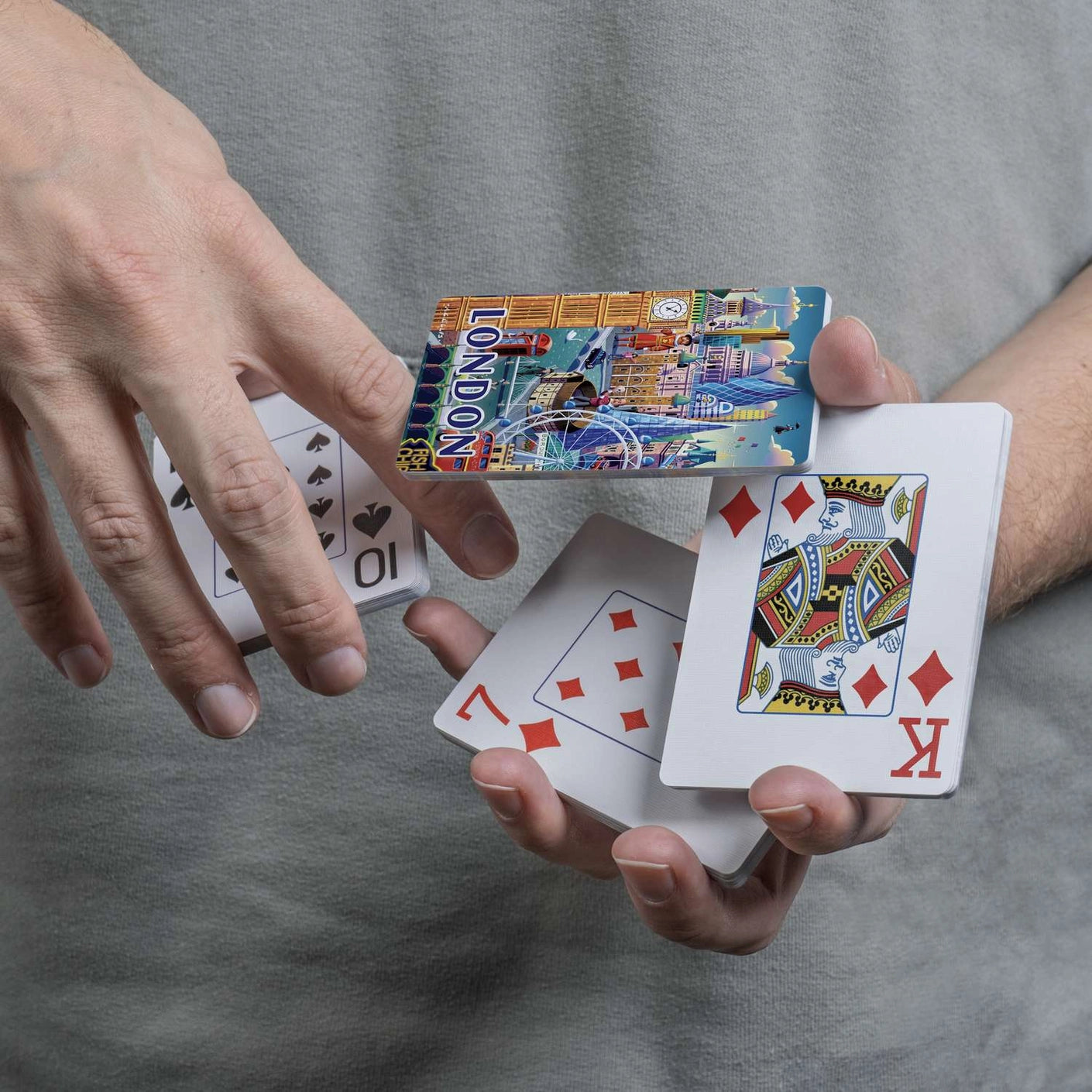 London scenic card back displayed during a flourish with traditional playing-card faces