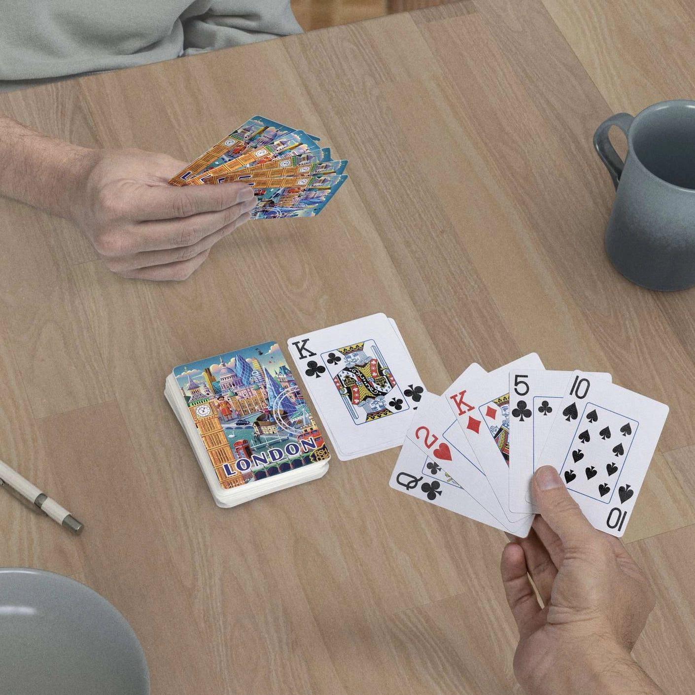 London jumbo-index playing cards in use at a table with colorful London cityscape card backs