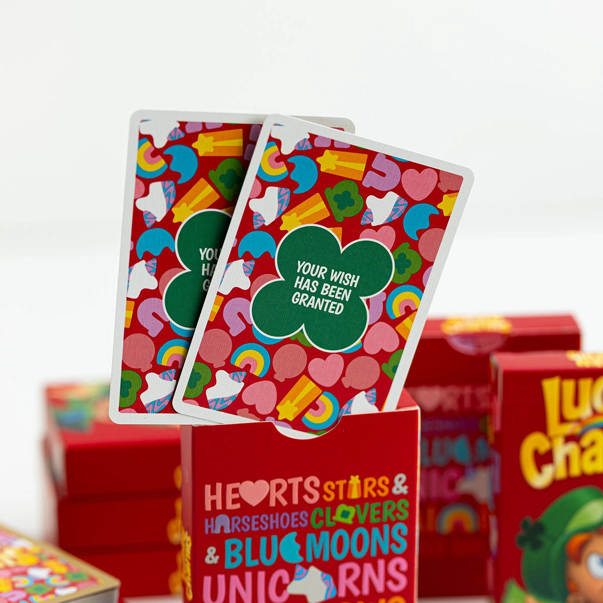 Two Lucky Charms cards with green clovers and the message “Your wish has been granted” over colorful marshmallow artwork.