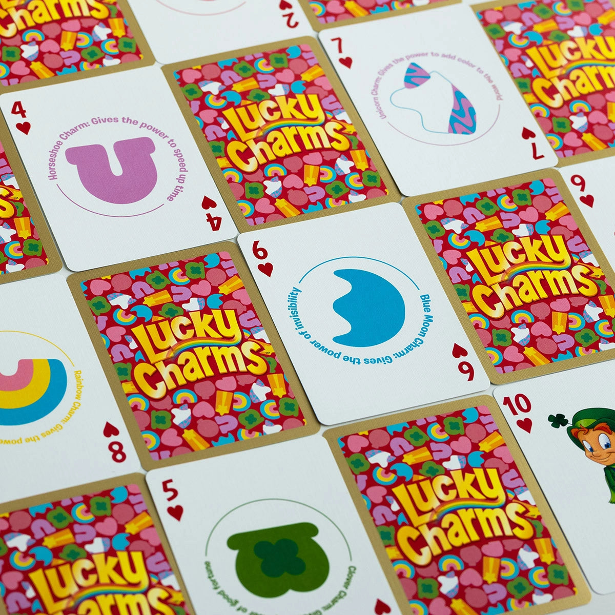 Alternating Lucky Charms card backs and illustrated number cards showing horseshoe, moon, unicorn, rainbow, and clover-hat charms.