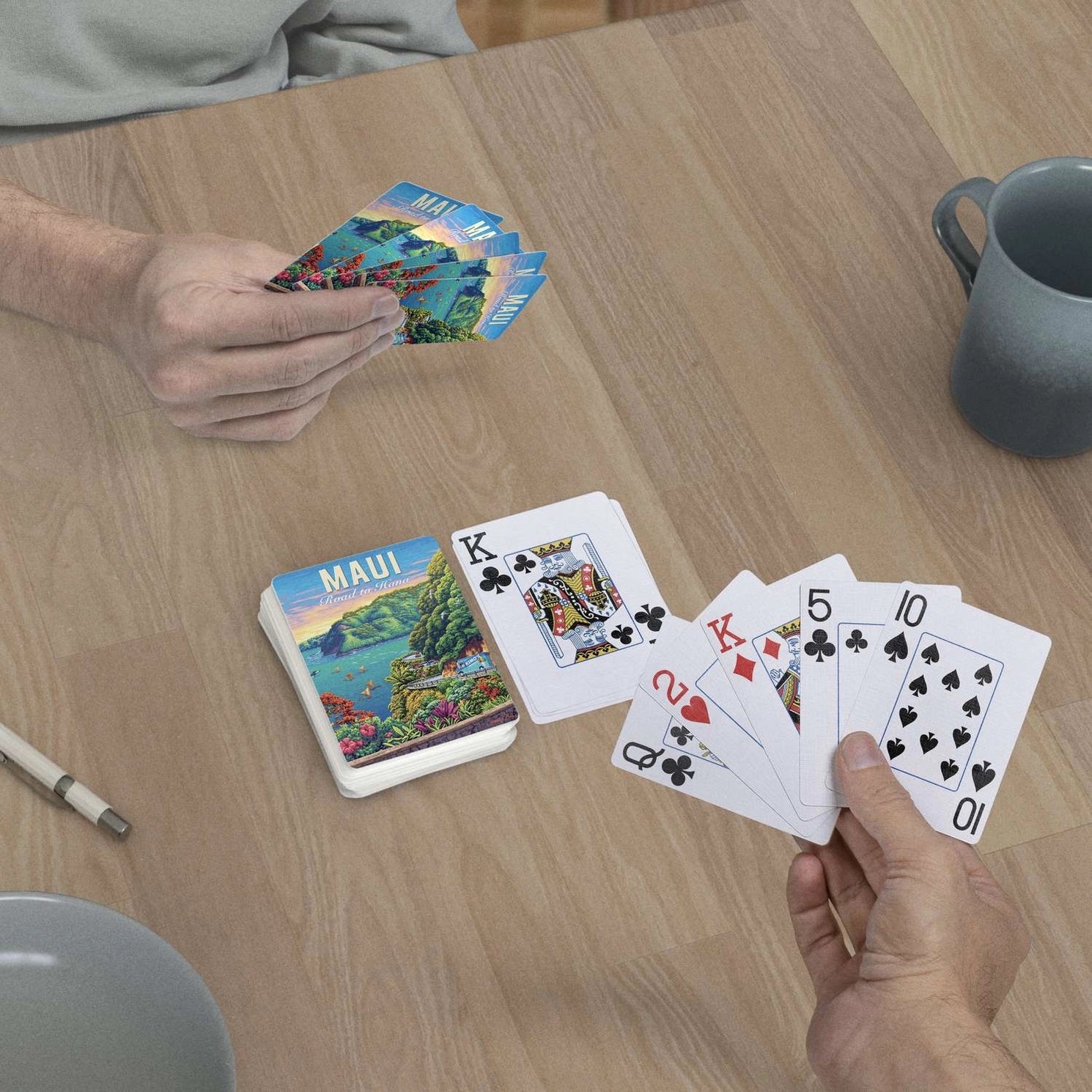 Maui Road to Hana jumbo-index playing cards in use at a table with colorful Maui scenic card backs