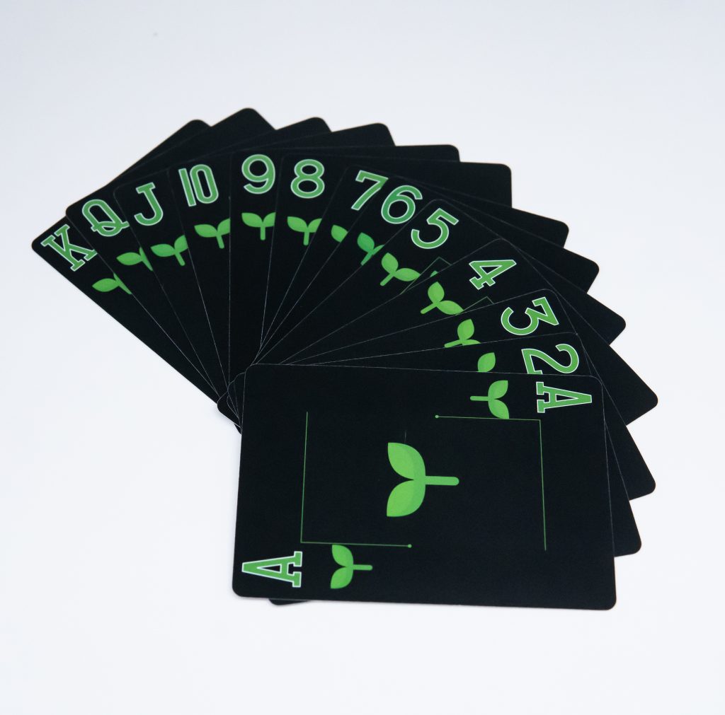 Repoker Black cards fanned to show the green Plant suit