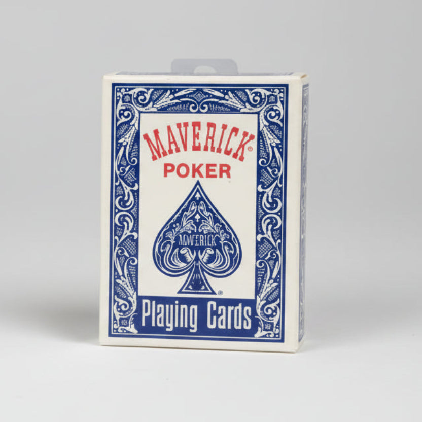 Two packs of Maverick Poker playing cards on a dark textured surface