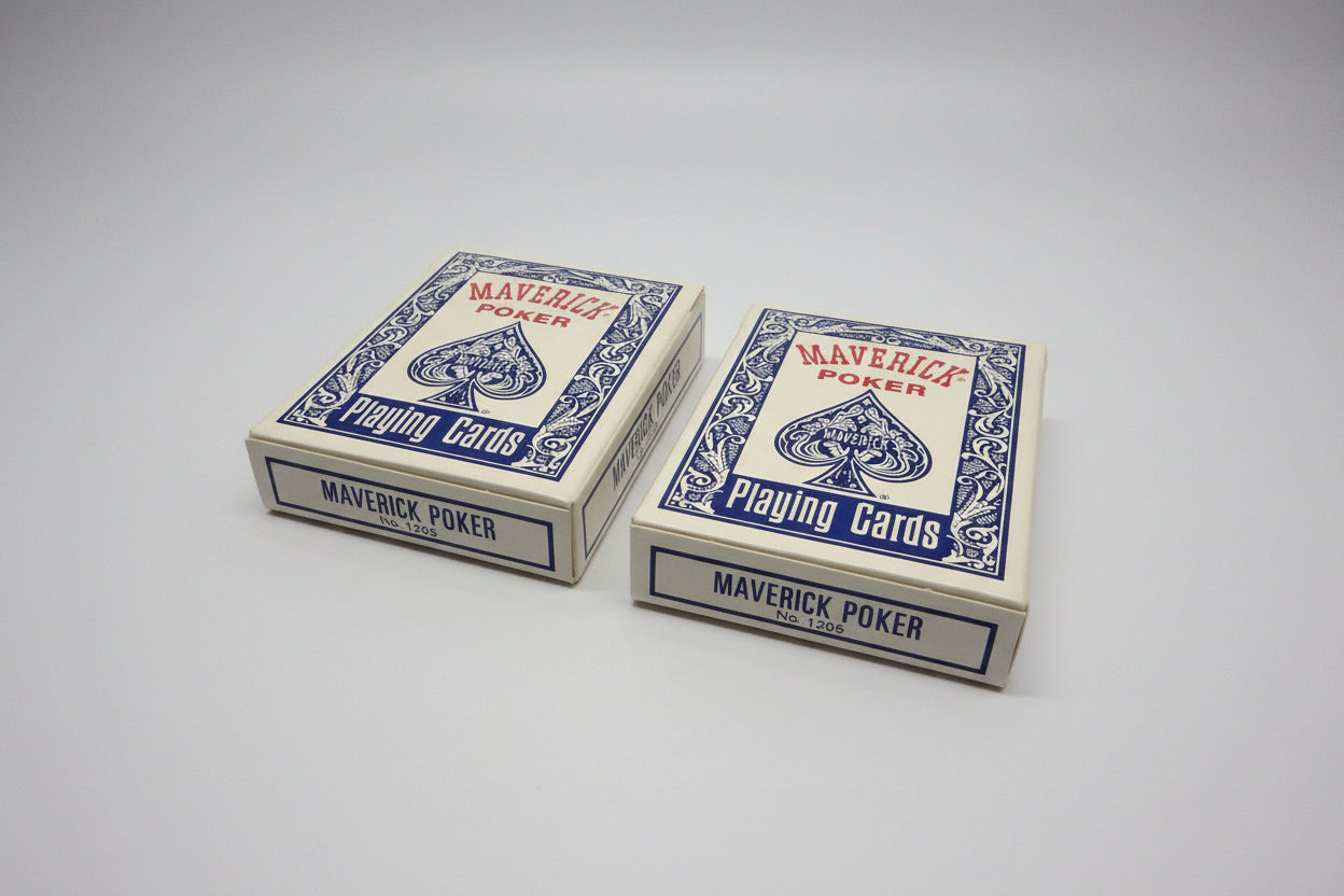 Two boxes of Maverick Poker playing cards on a gray surface