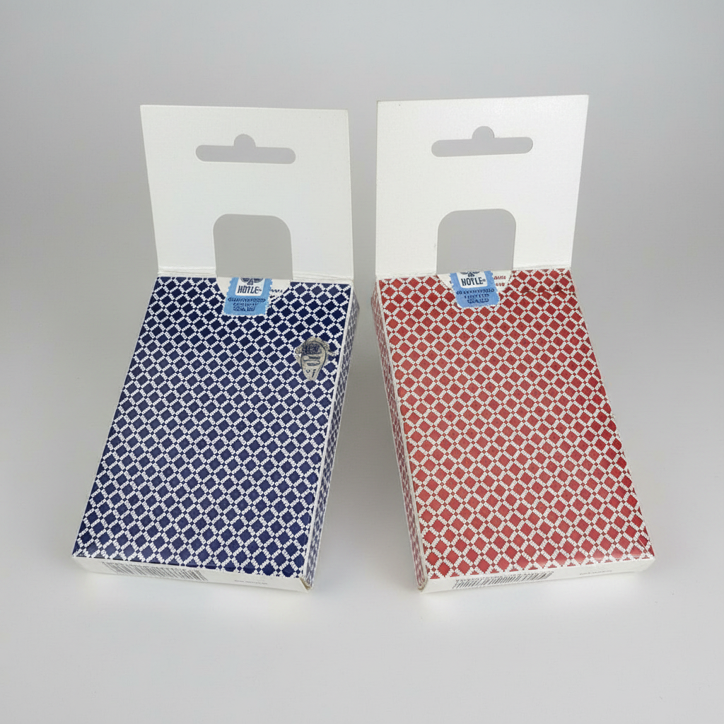 Two patterned fabric swatches in packaging on a white background