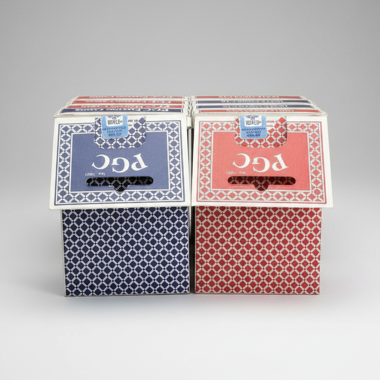 Two decks of PGC playing cards, one blue and one red, on a white background.