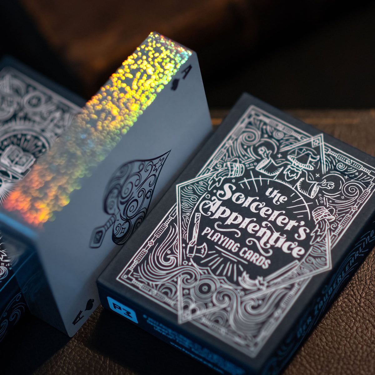 Sorcerer’s Apprentice Holographic Gilded deck showing rainbow-reflective silver edges beside its illustrated tuck box.