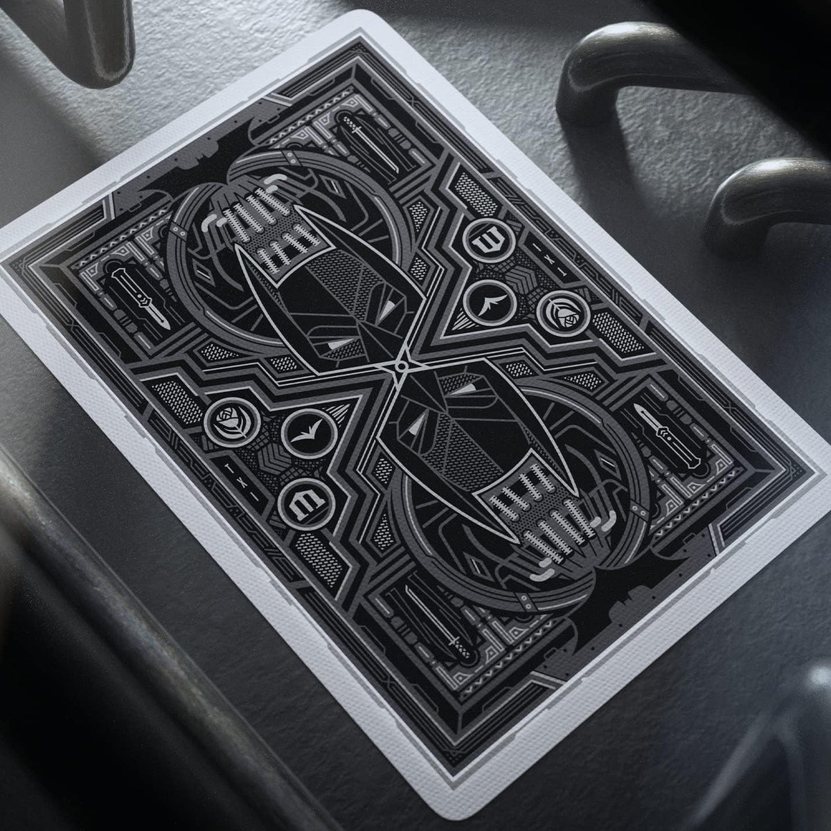Close-up of a theory11 The Dark Knight card back with mirrored Batman cowls, geometric details, and a white border.