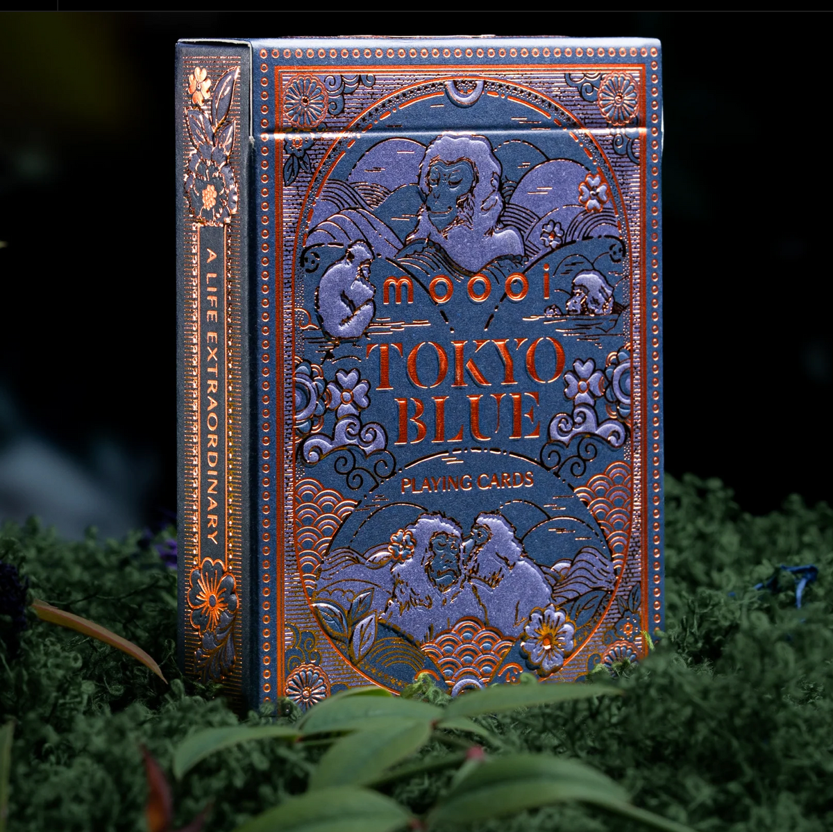 Upright theory11 Moooi Tokyo Blue tuck box with bronze foil macaques, flowers, and wave patterns on deep blue.