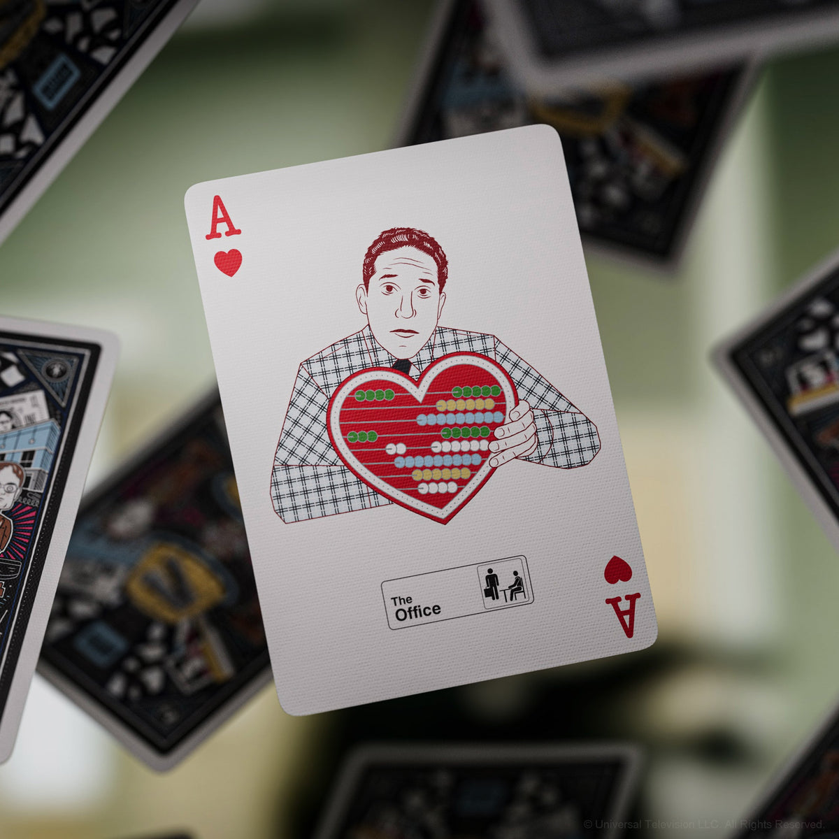 The Office Playing Cards Ace of Hearts showing a character holding a red heart-shaped chart