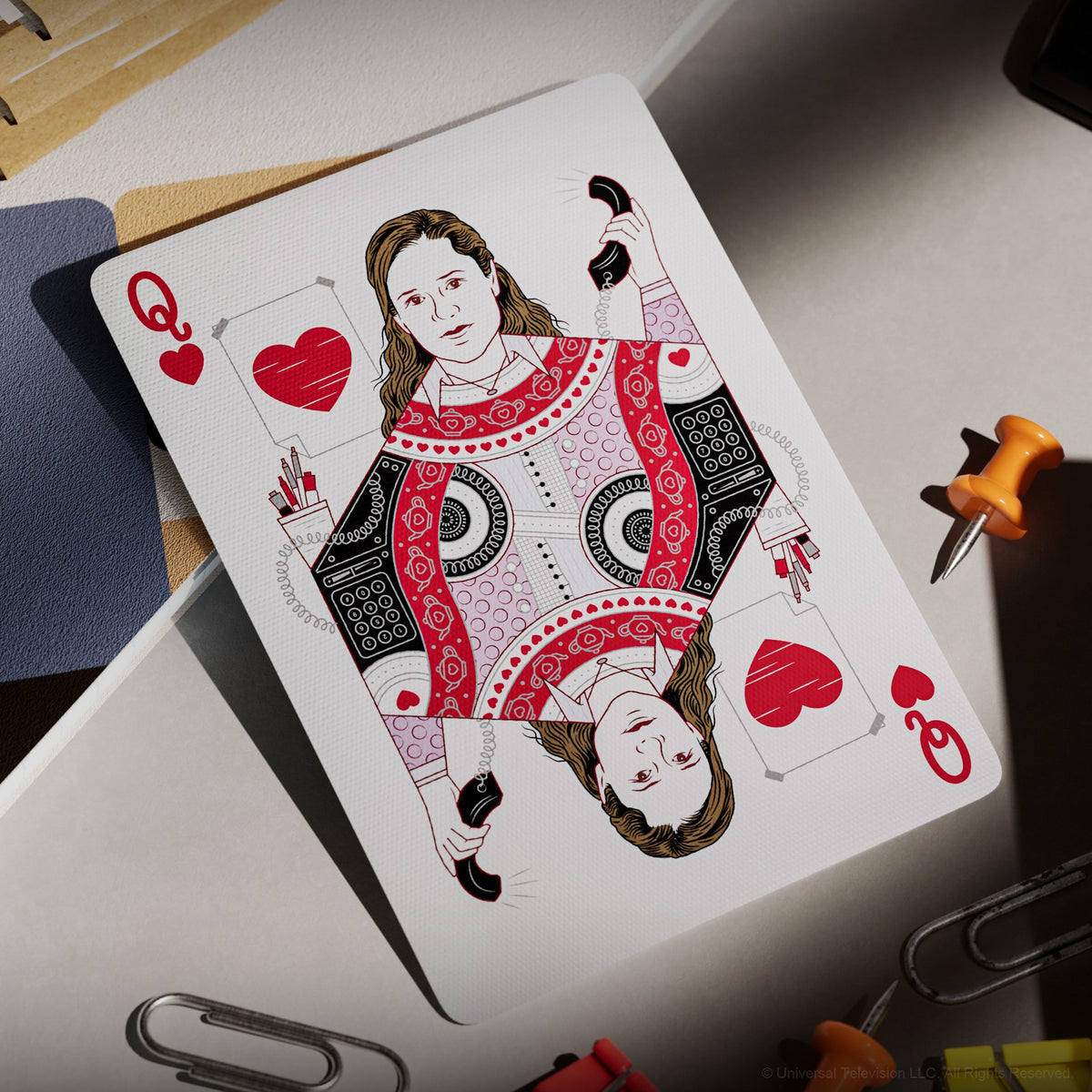 Pam Beesly illustrated on The Office Playing Cards Queen of Hearts holding an office phone