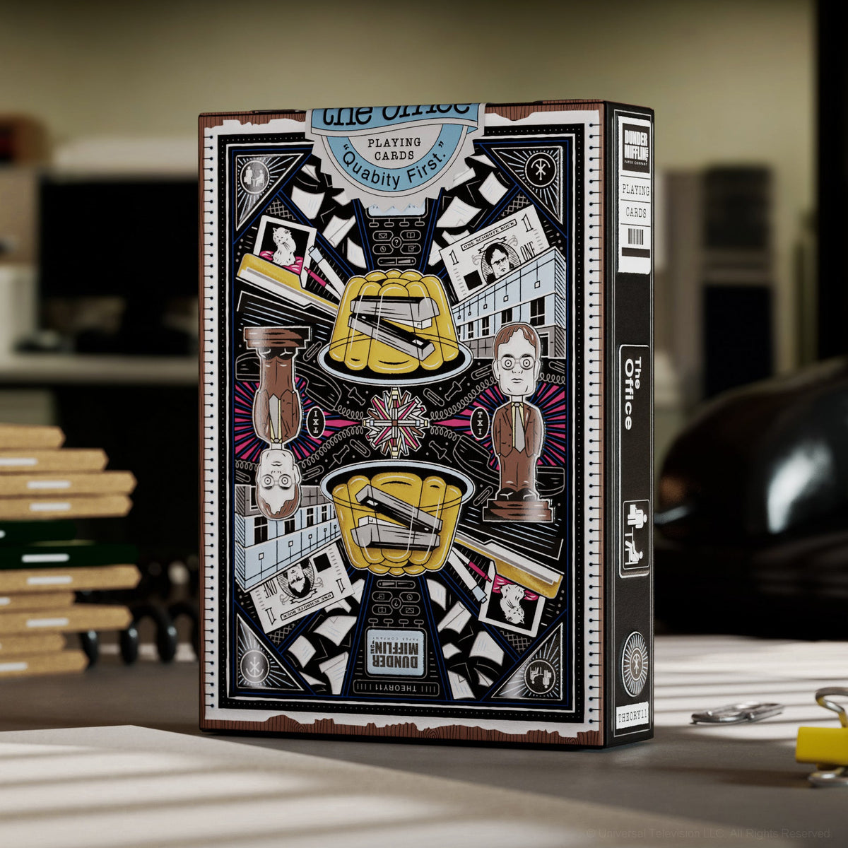 Back of The Office Playing Cards tuck box with Dunder Mifflin artwork, stapler in gelatin, and Dwight figure