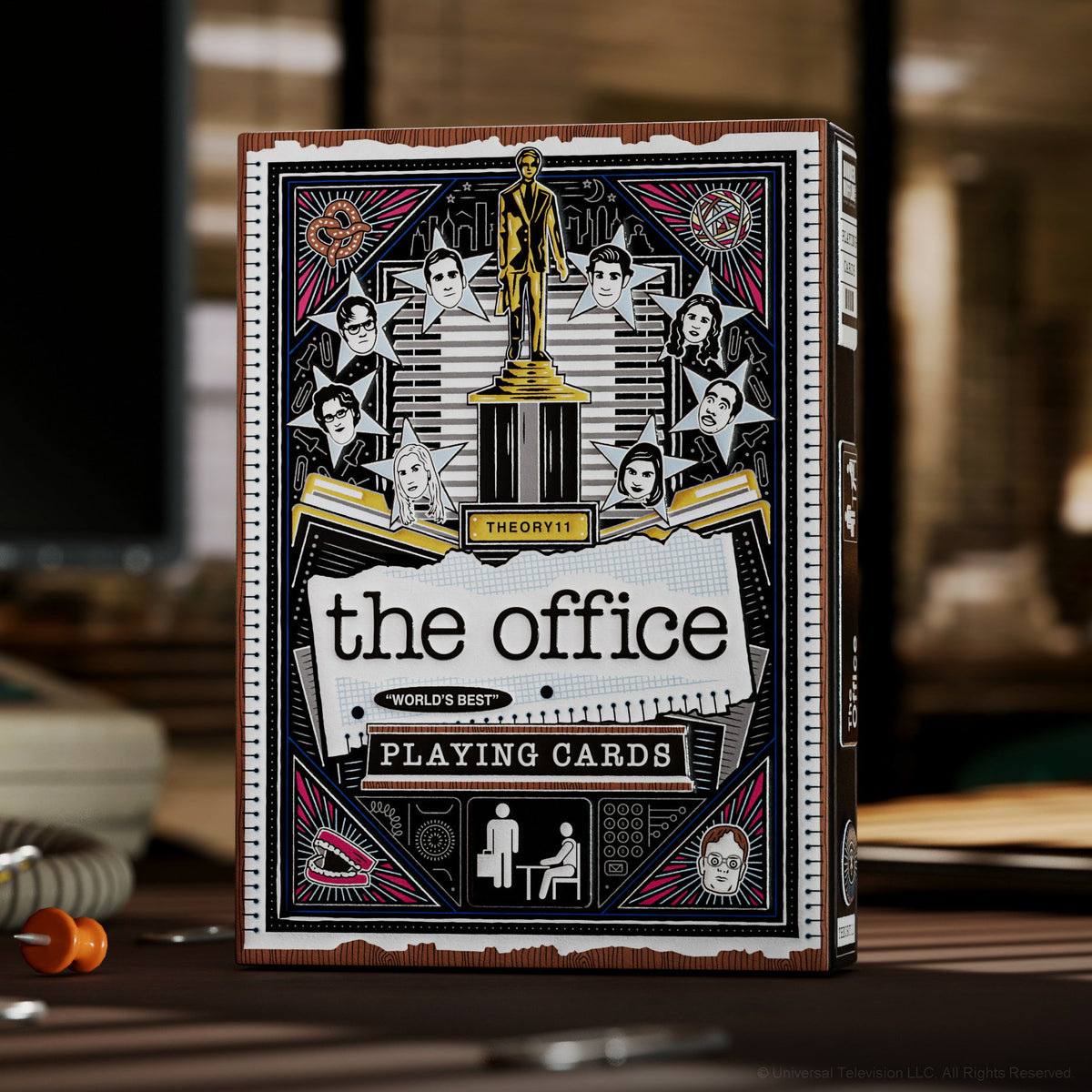 Theory11 The Office Playing Cards tuck box standing upright on an office desk