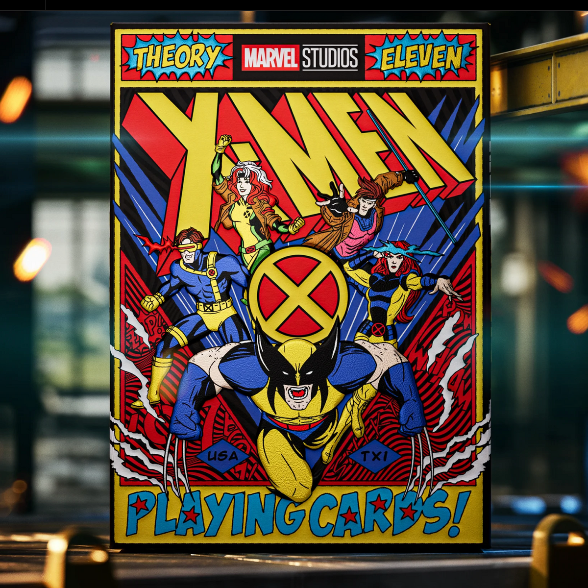 Front of the theory11 X-Men tuck box with Wolverine, Cyclops, Rogue, Gambit, and Jean Grey beneath large X-Men lettering.