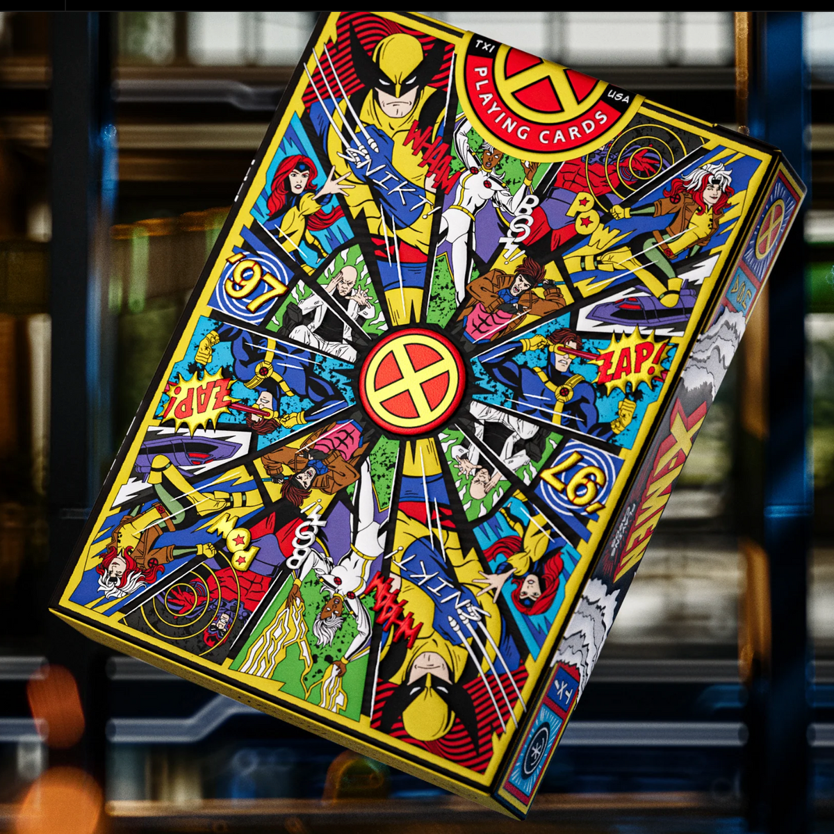Upright rear view of the theory11 X-Men tuck box with a colorful character collage, central X emblem, and round seal.