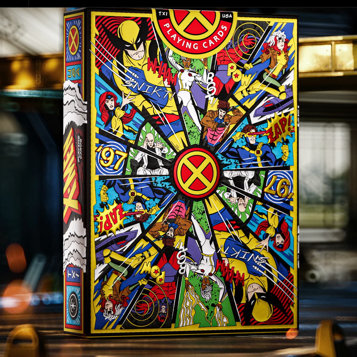Upright rear view of the theory11 X-Men tuck box with a colorful character collage, central X emblem, and round seal.