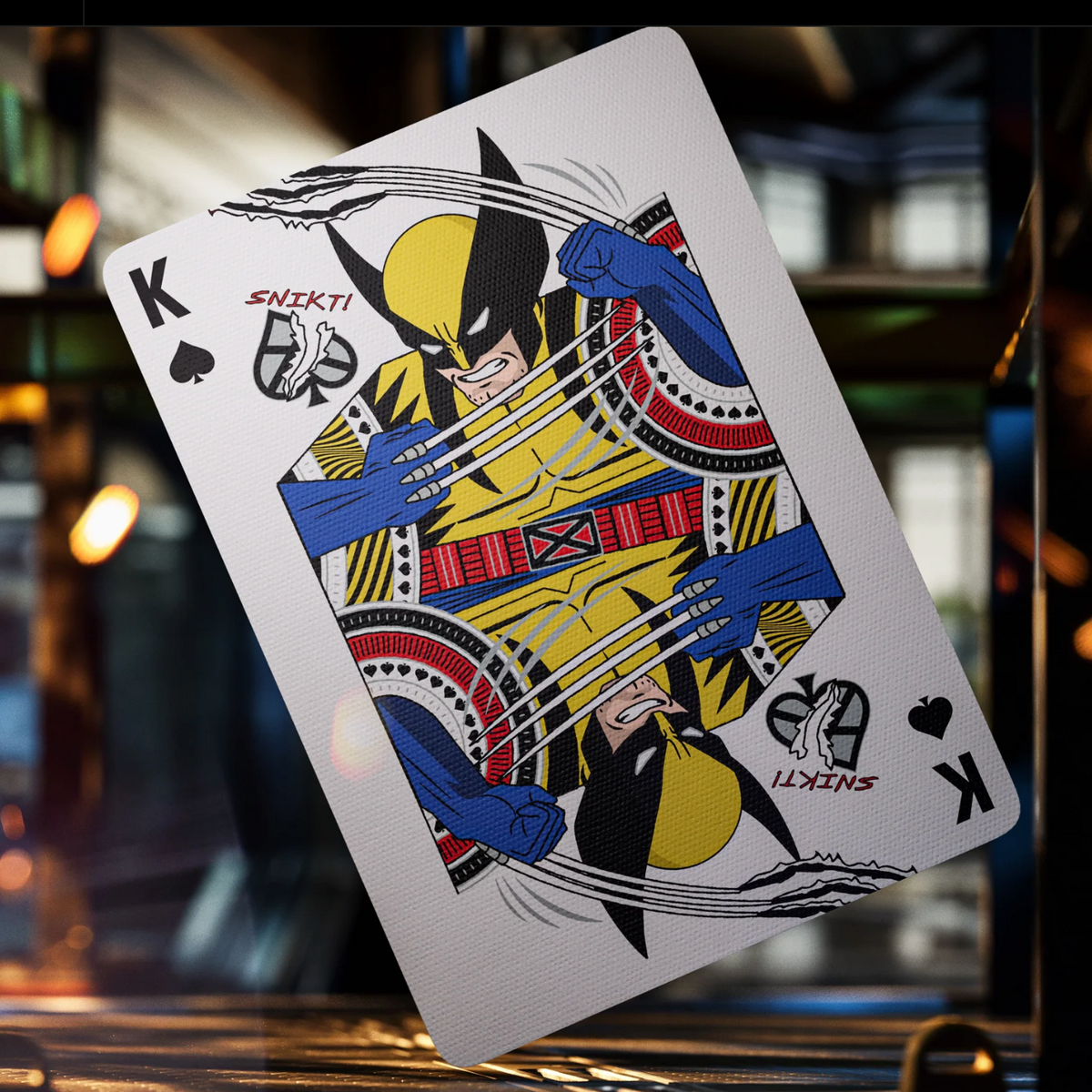 Wolverine as the King of Spades in theory11 X-Men Playing Cards, with extended claws and mirrored yellow-and-blue artwork.