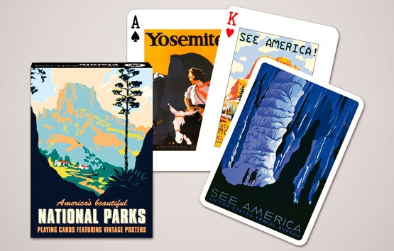 Playing cards with vintage National Parks posters on a gray background