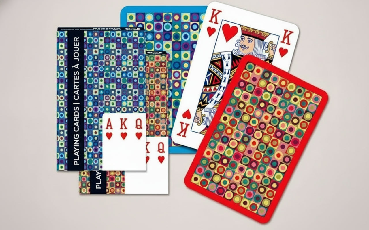 Colorful Piatnik Dots playing cards with various dot designs on a light gray background