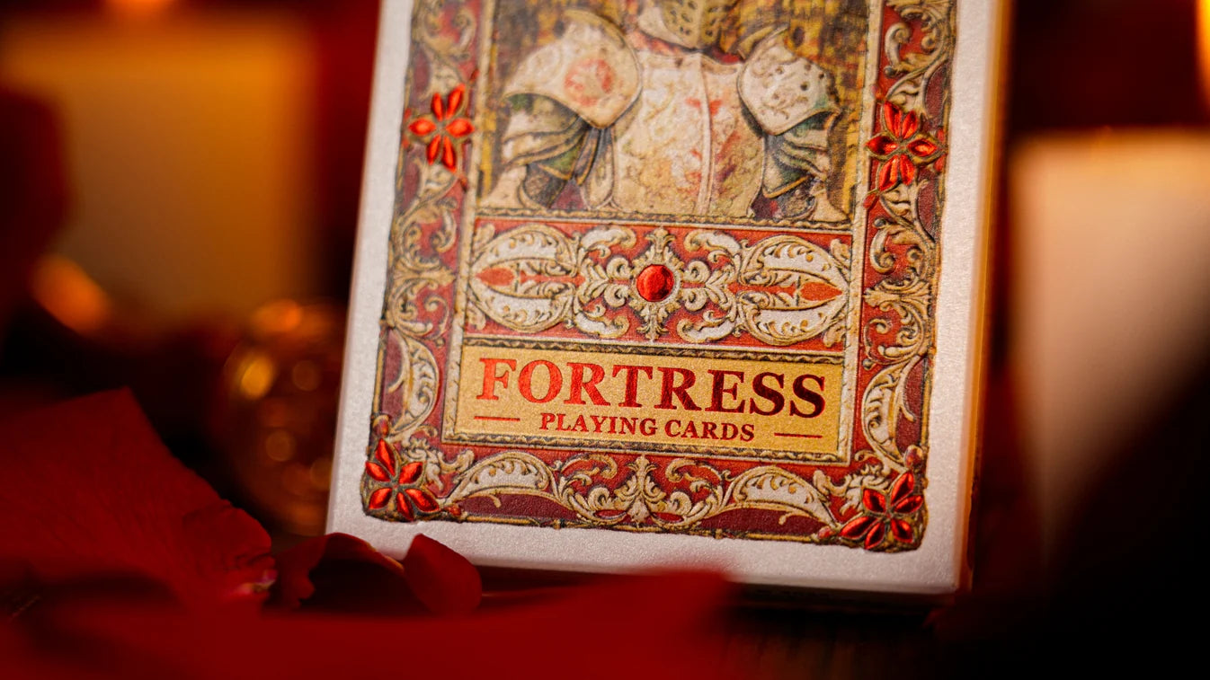 Close-up of Fortress Playing Cards title and ornate red foil tuck artwork