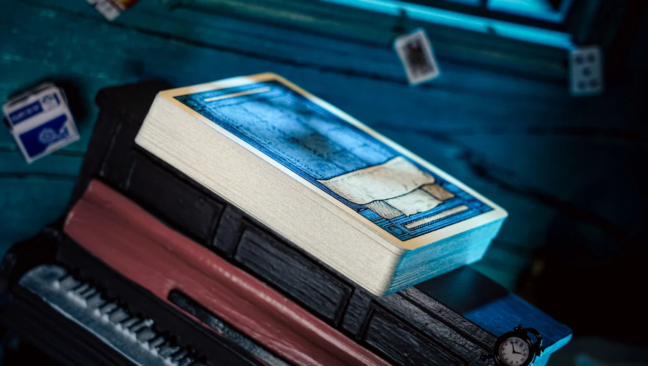 Stack of Sleep Walk Playing Cards showing cream paper edges and blue bed back