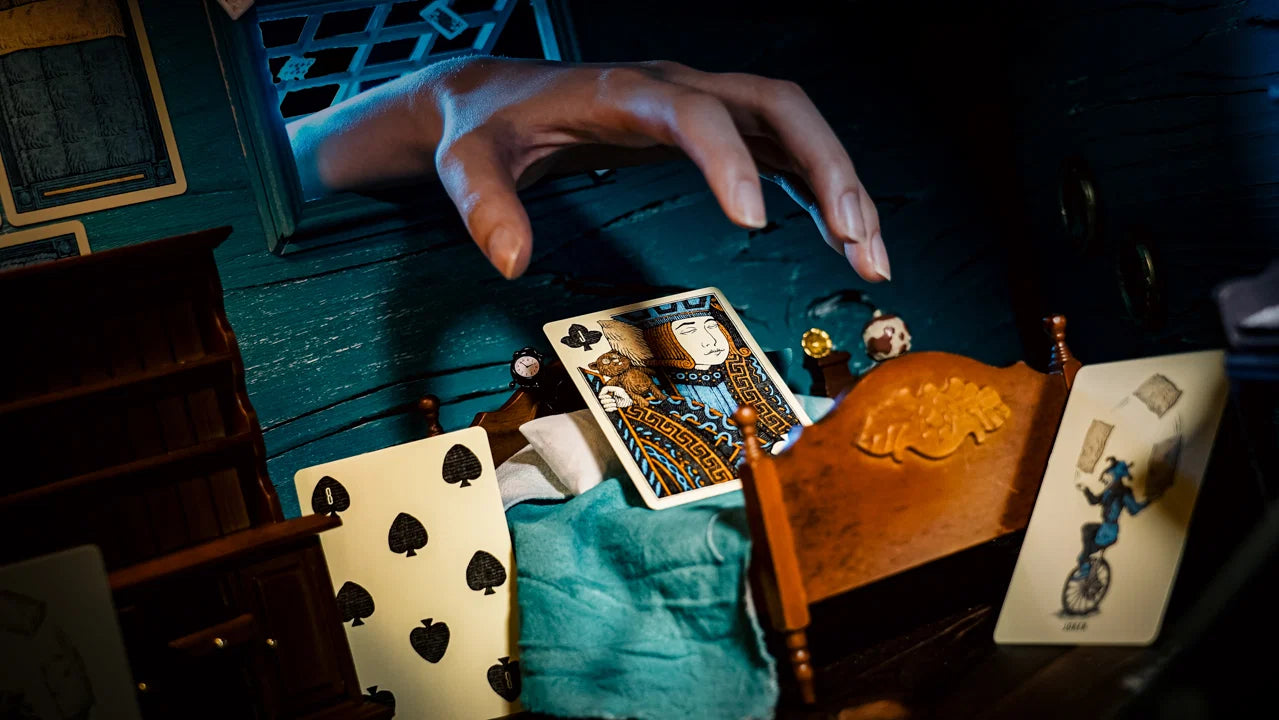 Sleep Walk playing cards staged in a miniature dreamlike bedroom scene